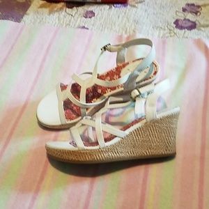 A wedge heel sandal.